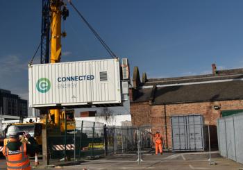 One of the two battery energy storage systems, which use re-purposed end-of-life EV batteries, being craned into position at Nottingham Council’s Eastcroft Depot