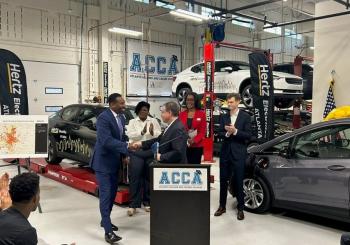 Hertz Chair and CEO Stephen Scherr and Mayor of Atlanta Andre Dickens shake hands at the launch of Hertz Electrifies Atlanta