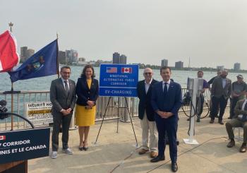Canadian Minister of Transport Omar Alghabra, Michigan Governor Gretchen Whitmer, Bill Baisden, IBEW Local 58 member and the founder and owner of Dynamic Electrical Group, and U.S. Transportation Secretary Pete Buttigieg in Detroit to announce the first Binational EV Corridor