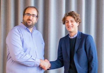 Enric Asunción, co-founder and CEO of Wallbox (left) and Ferdinand Schlutius, Co-CEO of ABL, shake on the deal which will enhance Wallbox’s competitive position in key markets while accelerating its path to profitability. Photo: ABL