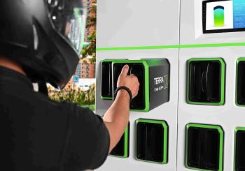 A driver swapping a battery from Terra's swapping station. Photo: AETOSWire